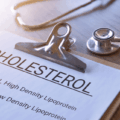 Patient consulting a doctor at Dr. Michael Bazel Clinic about managing high cholesterol.